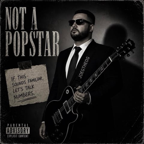 Man in black suit and sunglasses holding electric guitar with text Not a Popstar and parental advisory label